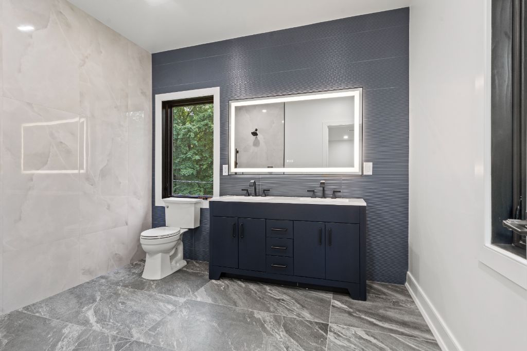 Riverview Terrace Residence, Primary bath · navy vanity