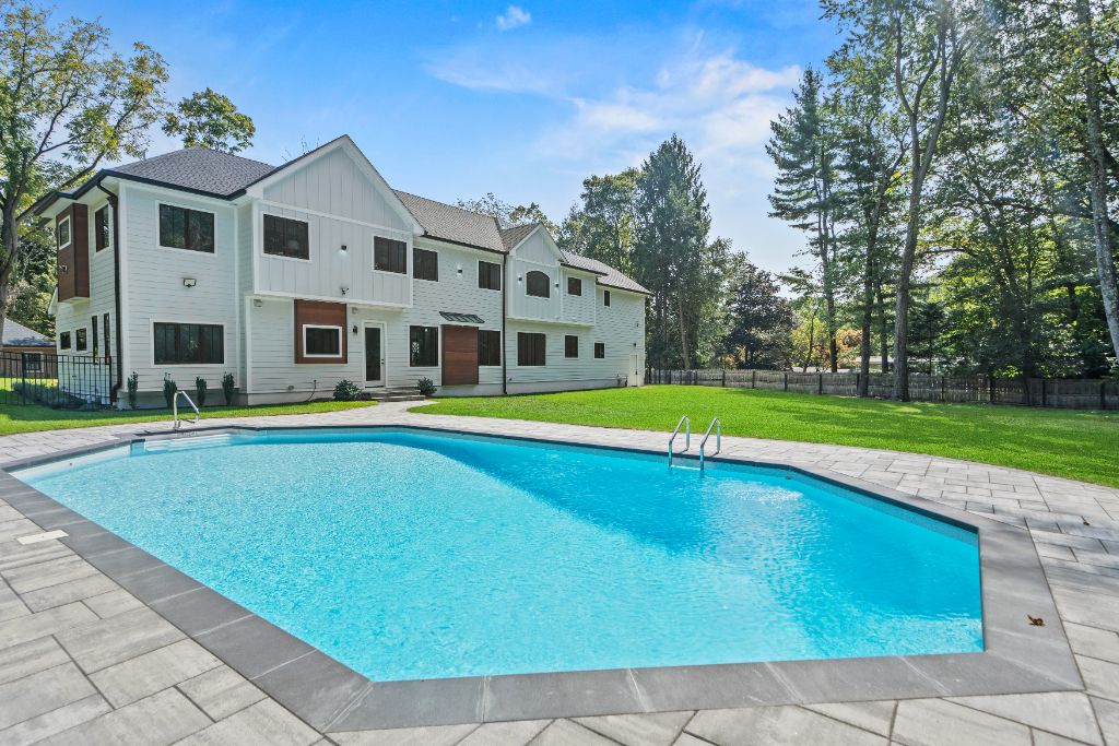 Brook Road Residence, Rear elevation · heated pool