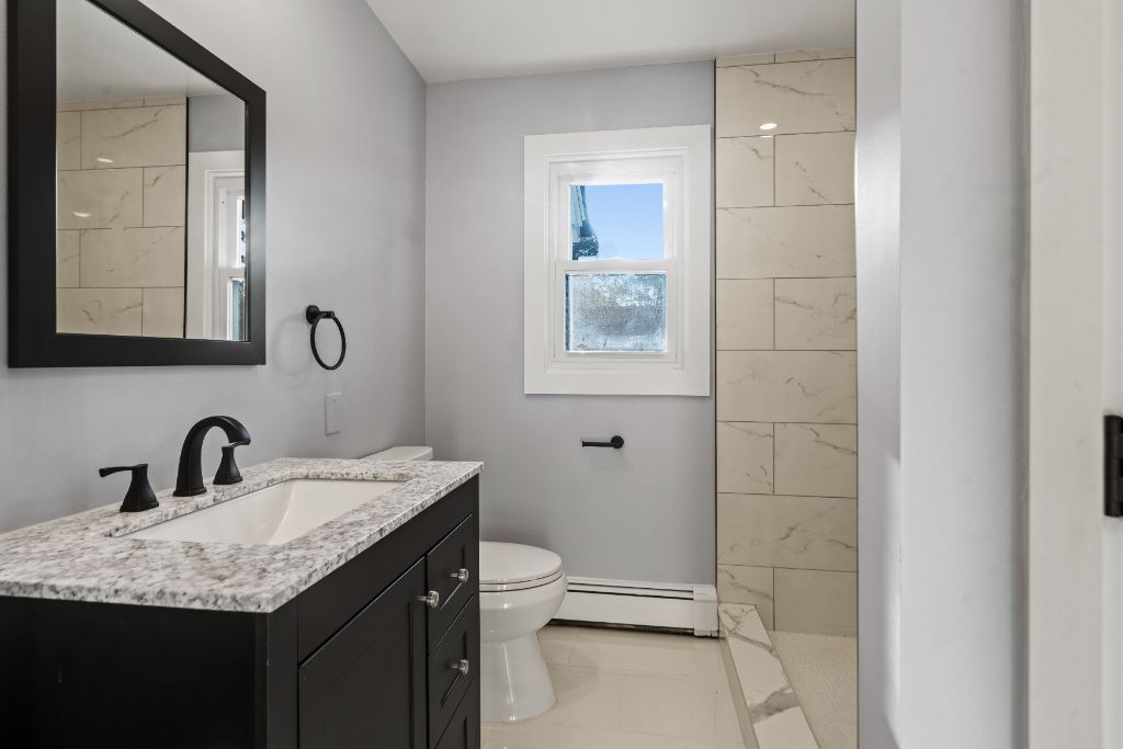 Lincoln Place Residences, Renovated bath · marble